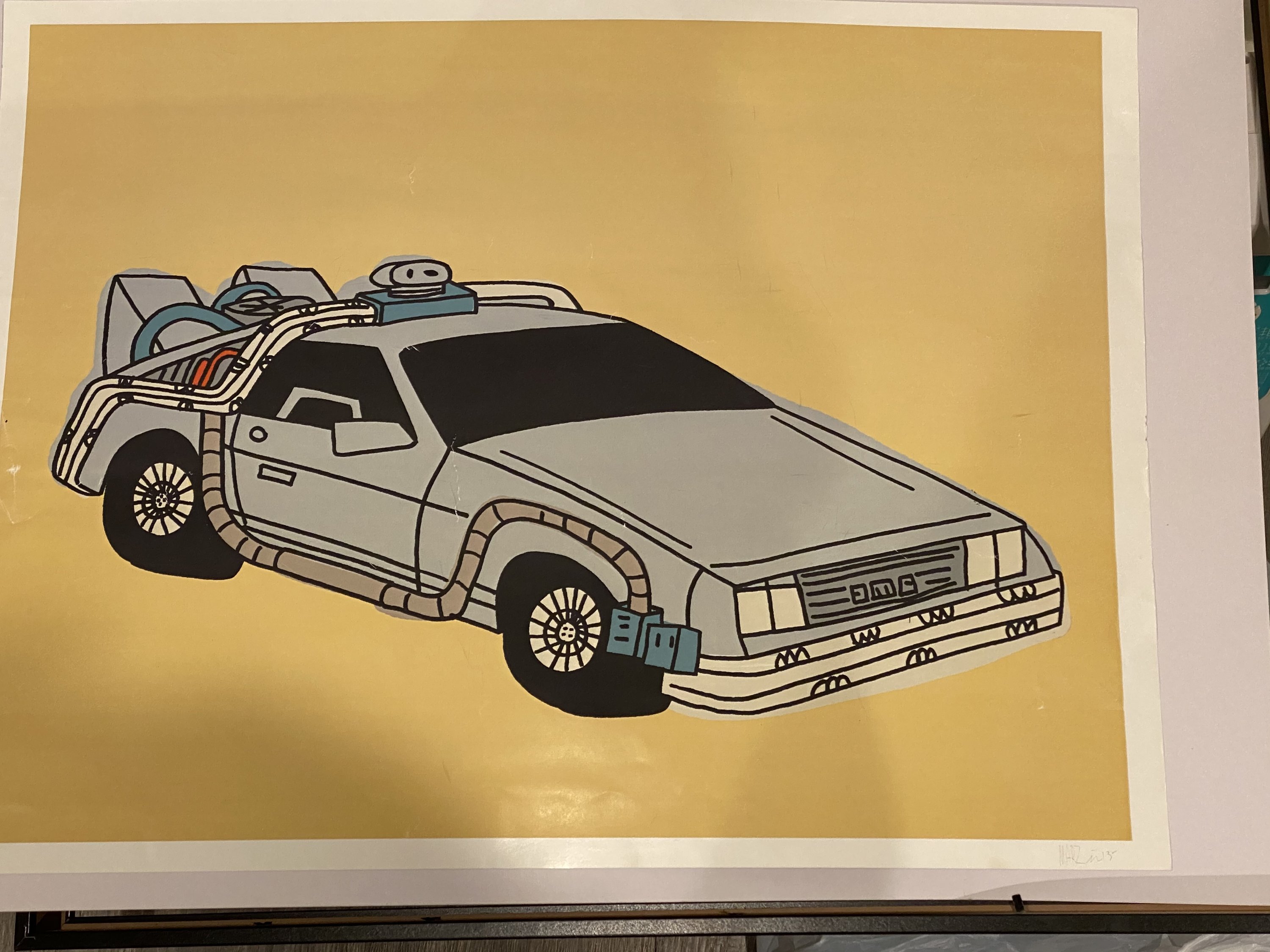 Rare Marz Jr. signed pop art of DMC DeLorean, framed and colorful, showcasing nostalgic design.